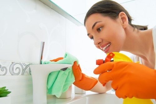 Cleaning specialist applying safe hygiene practices during service